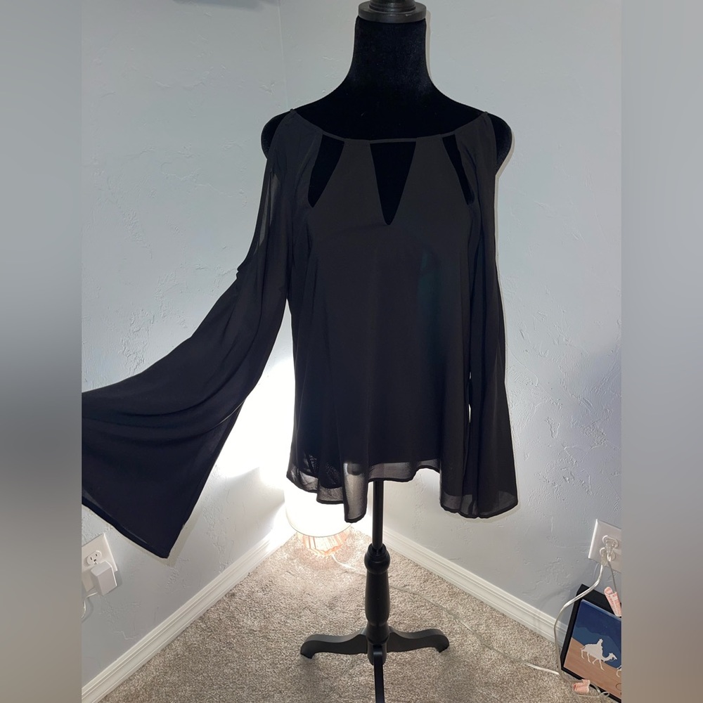 Nice black blouse with fluted sleeves and cutout along the neck.